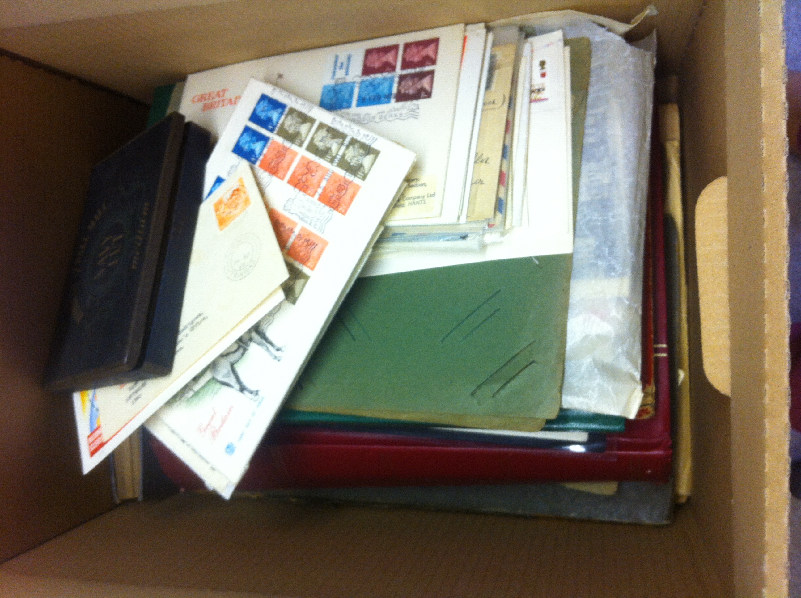 STAMPS : Box with world selection in stockbooks, loose etc. Also covers & old postcards.