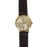 OMEGA, SEAMASTER: A GOLD GENTLEMAN'S WRISTWATCH, CIRCA 1965 automatic movement, silver dial with