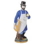 A RUSSIAN PORCELAIN FIGURE OF A GLAZIER, GARDNER PORCELAIN MANUFACTORY, 1830s-1840s wearing a