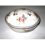 A SEVRES SUCRIER AND COVER, 1764 quattrefoil oval, painted in colours with scattered loose bouquets,