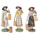 THREE DERBY FIGURES OF MILKMAIDS, CIRCA 1820 each standing carrying milk pails and wearing a