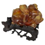 A CHINESE CARVED AGATE GROUP OF A PAIR OF SQUIRRELS, QING DYNASTY, 18TH/19TH CENTURY the animals