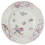 A CHELSEA SOUP PLATE, CIRCA 1755 of 'Warren Hastings' type, painted with scattered flower sprays and