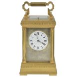A FRENCH GILT-BRASS CARRIAGE CLOCK, CIRCA 1905 repeating movement striking on a gong, circular white