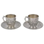 A PAIR OF CHINESE SILVER CUPS AND SAUCERS, UNMARKED, EARLY 20TH CENTURY the cups applied with bamboo
