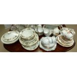 A Royal Doulton 'Larchmont' part dinner service; a Royal Albert 'Orient' part tea service; a