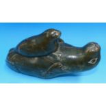 An Eskimo large carved soapstone seal with pup
