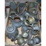 A selection of 18th century and later pewter mugs; etc.