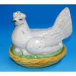 A Staffordshire pottery chicken on nest egg crock