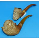 A 19th century meerschaum pipe, Turk's head; a similar pipe, claw and bowl
