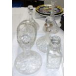 A cut glass ship's decanter with silver mounts; 2 others, and 3 other pieces