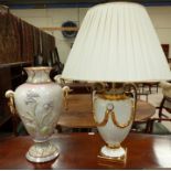 A classical urn style white and gilt pottery table lamp, and similar urn