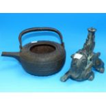 An antique Japanese tetsubin cast iron kettle (no lid); an oriental bronzed pricket candlestick