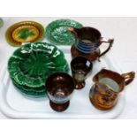 Five majolica plates and 3 pieces of copper lustre