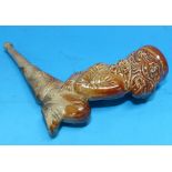 A 19th century salt glaze stoneware monkey caricature pipe