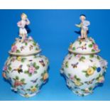 A pair of Dresden encrusted covered vases with figure finials, height 11½" (a.f.)