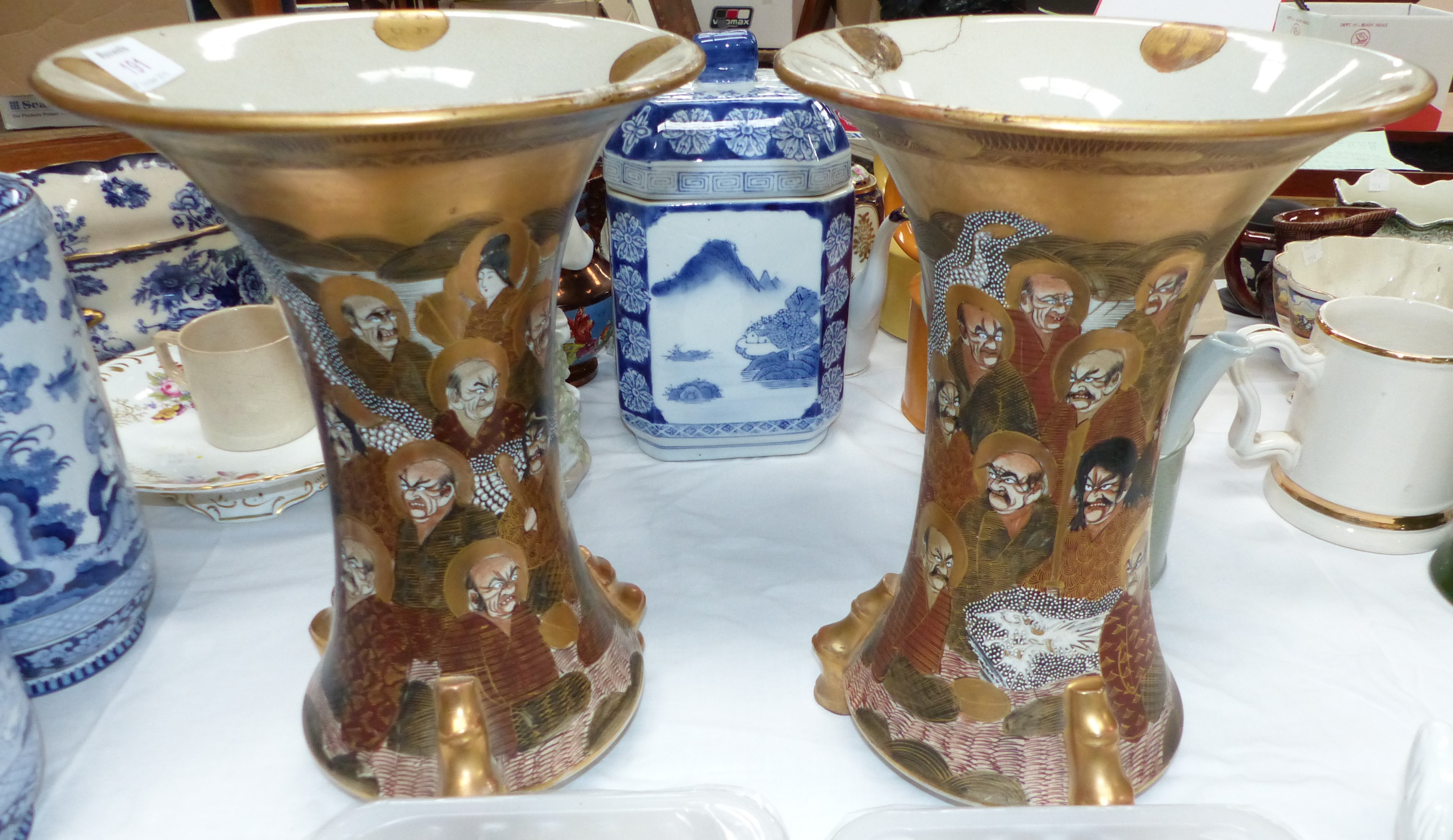 A pair of early 20th century flared and waisted Satsuma vases decorated with Immortals, height 12.5"