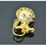 18ct Ruby and Diamond Lion BroochFeaturing a stylized textured 18ct yellow gold lion setwith ruby