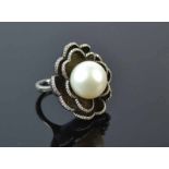 18ct Pearl and Diamond RingA textured Niello finish ring featuring two tiers of petalsedged with