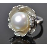 Platinum South Sea Pearl Ring A white 13mm South Sea pearl within a flower petalsetting offset