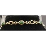 9ct Nephrite Jade BraceletA handcrafted twisted link bracelet set with ovalcabochons of New