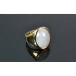 14ct Yellow Gold Jadeite Gents RingA large white/purple tinged oval Jadeite cabochonset in a tapered