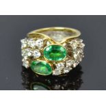 18ct Yellow Gold Emerald Diamond RingTwin emeralds bezel set with scattered diamondsto the