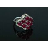 14ct White Gold Ruby and Diamond RingA marquise shaped cluster of rubies approximately4.50cts deep