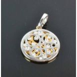 9ct Two Tone Gold and Diamond PendantA pierced double disc of rose and white goldfeaturing 16 hammer