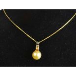 9ct Yellow Gold Diamond Pearl PendantAn orange/brown 0.23ct Argyle diamond set baleenhances a