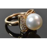 18ct South Sea Pearl Bow RingA smooth with 11.5mm pearl set in a raised bow designhighlighted by