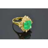 18ct Yellow Gold & Diamond RingFeaturing a 3.75ct medium vivid green emerald cut emerald with 18 rbc