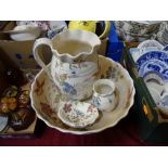 A floral and bird pattern four piece bathroom set comprising jug, bowl, soap dish and vase