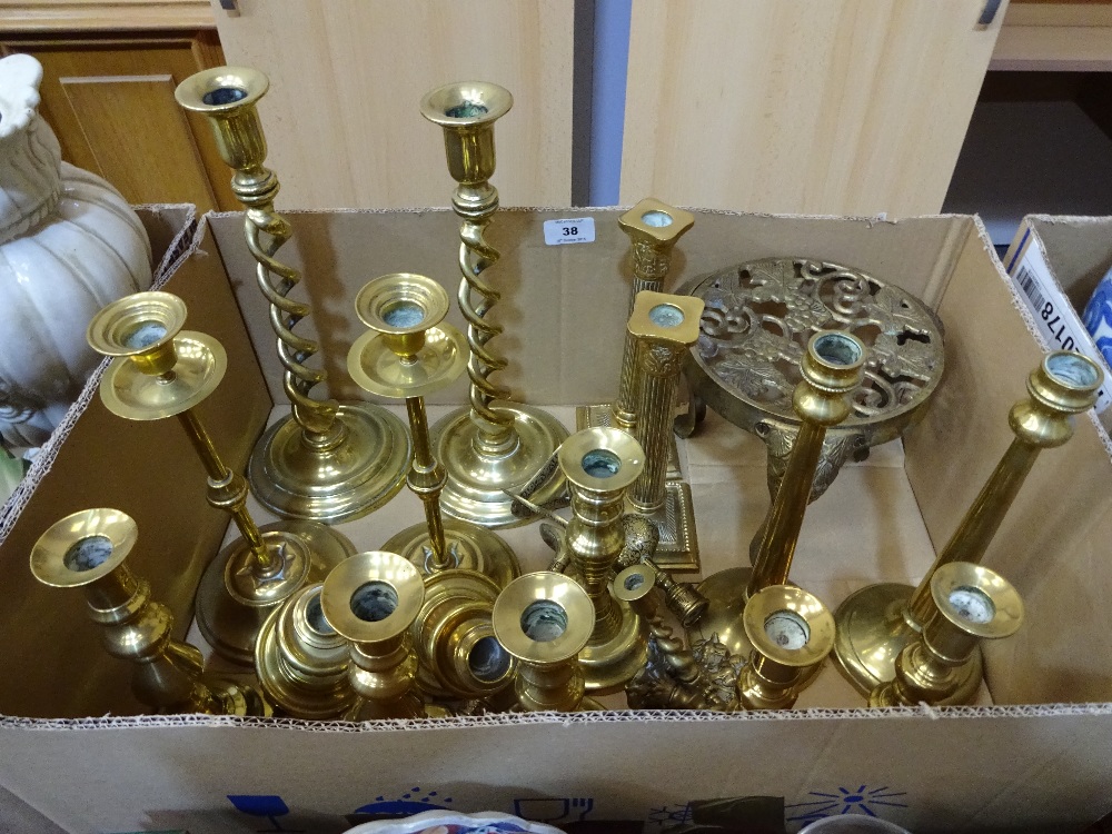 Ten pairs of brass candlesticks together with trivet