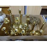 Ten pairs of brass candlesticks together with trivet