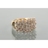 DIAMOND CLUSTER RING  set with five rows of brilliant cut diamonds, marked K18 for eighteen carat
