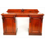 VICTORIAN MAHOGANY INVERSE BREAKFRONT PEDESTAL SIDEBOARD with central concealed drawer above two