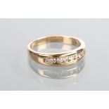 DIAMOND SET BAND with channel set diamonds totalling approximately 0.52 carats, unmarked, size Y-Z