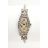 EARLY TWENTIETH CENTURY DIAMOND SET COCKTAIL WATCH  the white dial with Arabic numerals, with