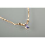 TANZANITE AND DIAMOND NECKLET set with a single pendeloque cut tanzanite approximately 8mm long with