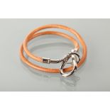 HERMES LEATHER BRACELET in tan leather, the buckle with HERMES and mongram, in box