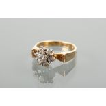 1970S DIAMOND CLUSTER RING with a cluster of brilliant cut diamonds, on a textured bark design