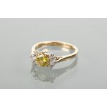 YELLOW AND WHITE DIAMOND RING the central diamond with yellow-green colour of approximately 0.73