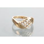 DIAMOND DRESS RING with three rows of channel set stones set diagonally, the diamonds totalling