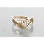 GOLD DIAMOND SET DRESS RING the channel set diamonds in rows two form a bow motif and totalling