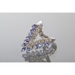 TANZANITE AND DIAMOND DRESS RING the open triangular ring set with oval tanzanites totalling