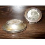 TWO SMALL SILVER CIRCULAR FRAMES