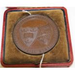 BRONZE OXFORD AND CAMBRIDGE ATHLETIC SPORTS PRIZE MEDAL
inside a fitted case, unengraved,