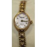 LADY'S NINE CARAT GOLD WRIST WATCH
the dial with baton numerals,