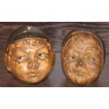 PAIR OF NOVELTY STONEWARE CHARACTER MONEY BANKS
modelled as boy's face and girl's face respectively;